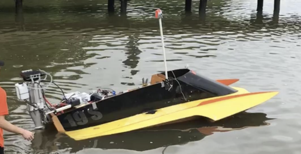 ten foot boat with electric motor and sensor tower bolted on.